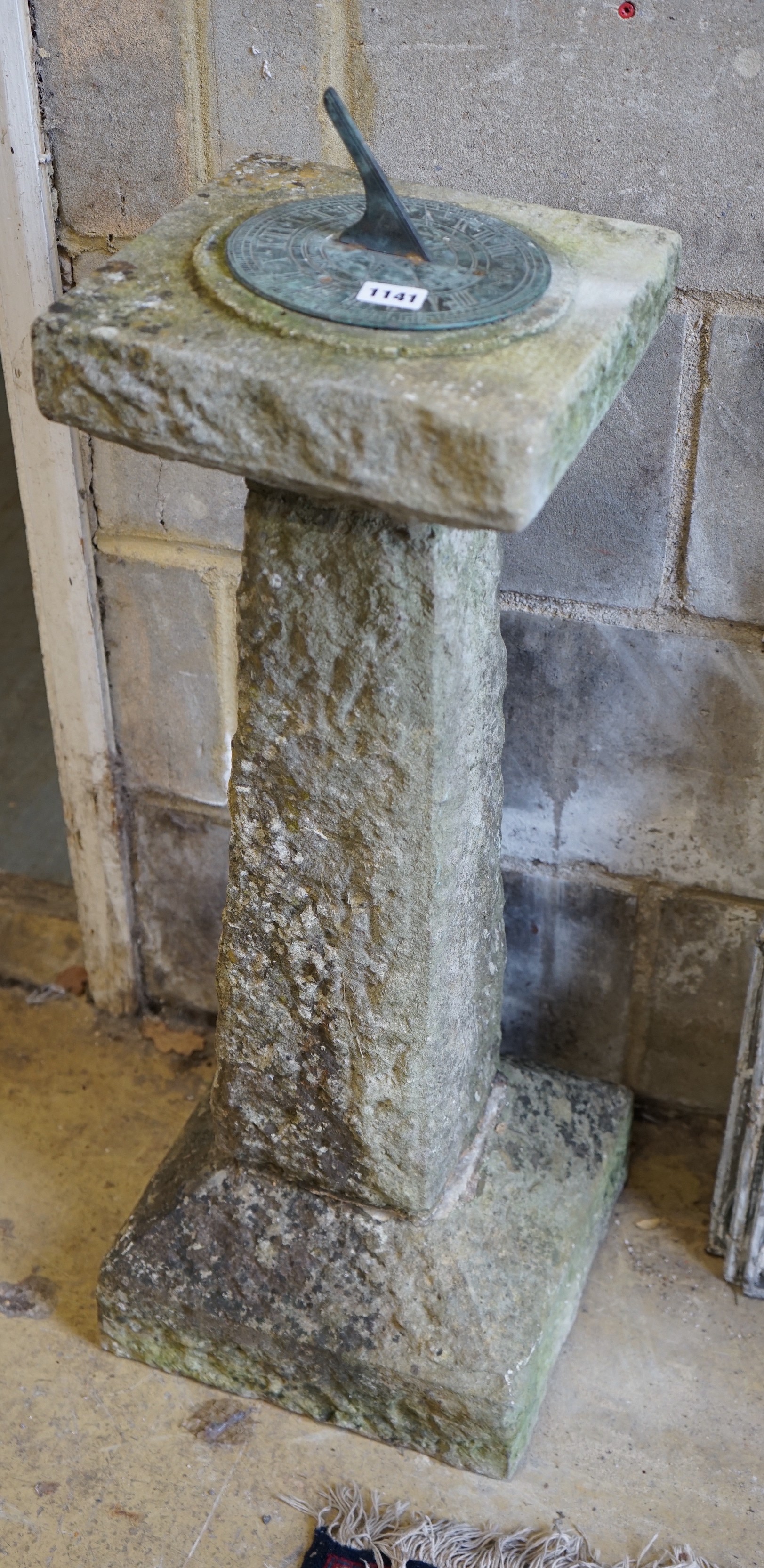 A reconstituted stone garden sun dial, height 88cm